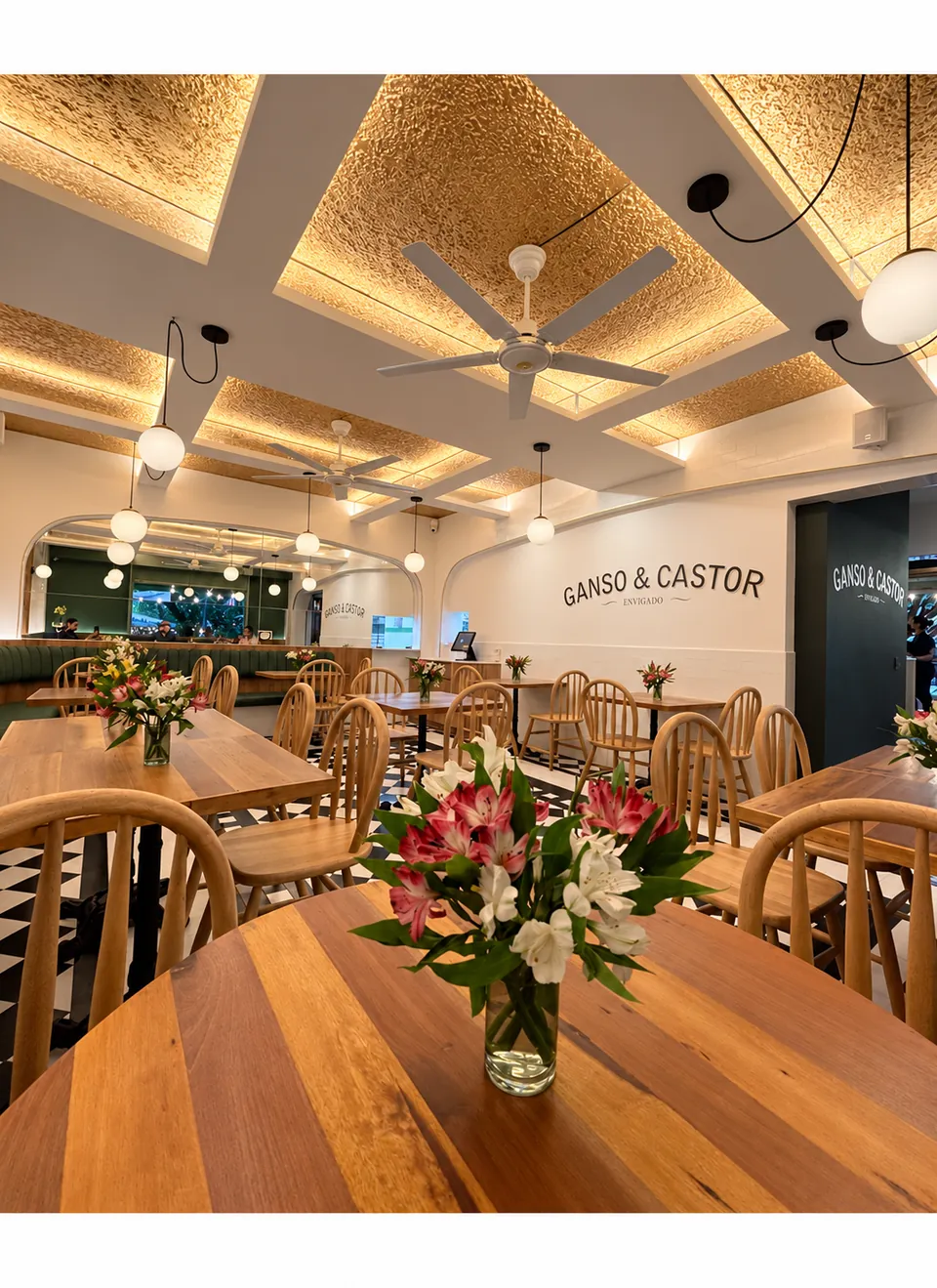 Ganso & Castor restaurant dining room with timber tables and a woven ceiling